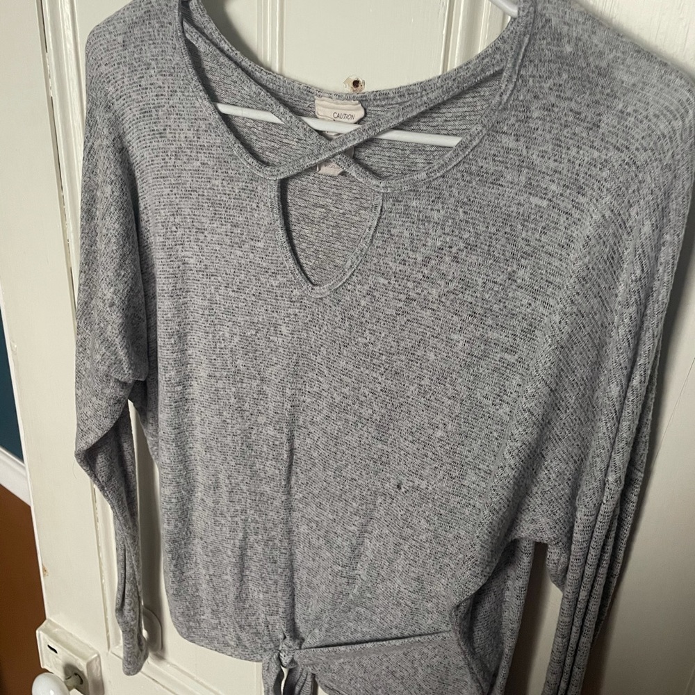 gray long sleeve with intricate neck cut-out